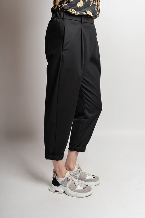 Pantaloni asimmetrici a pieghe Margret